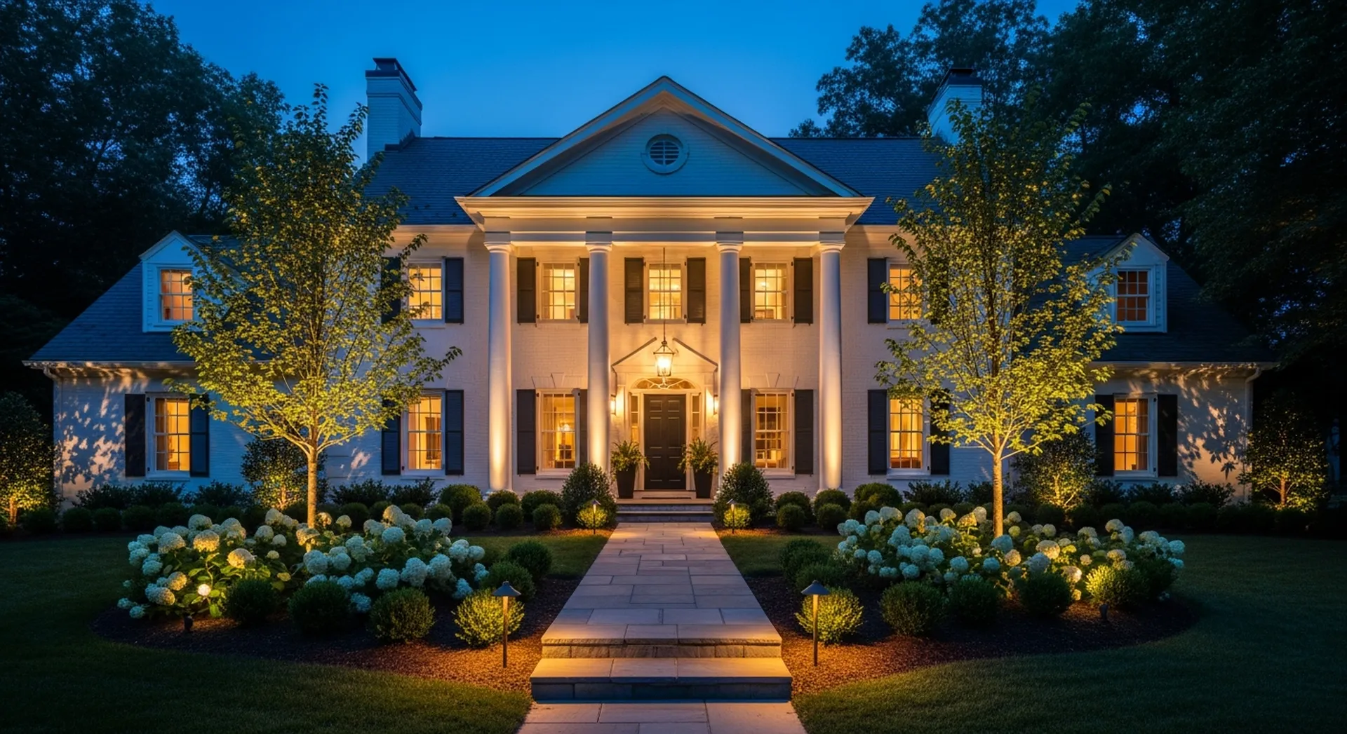 Warm landscape lighting on a Bethesda home